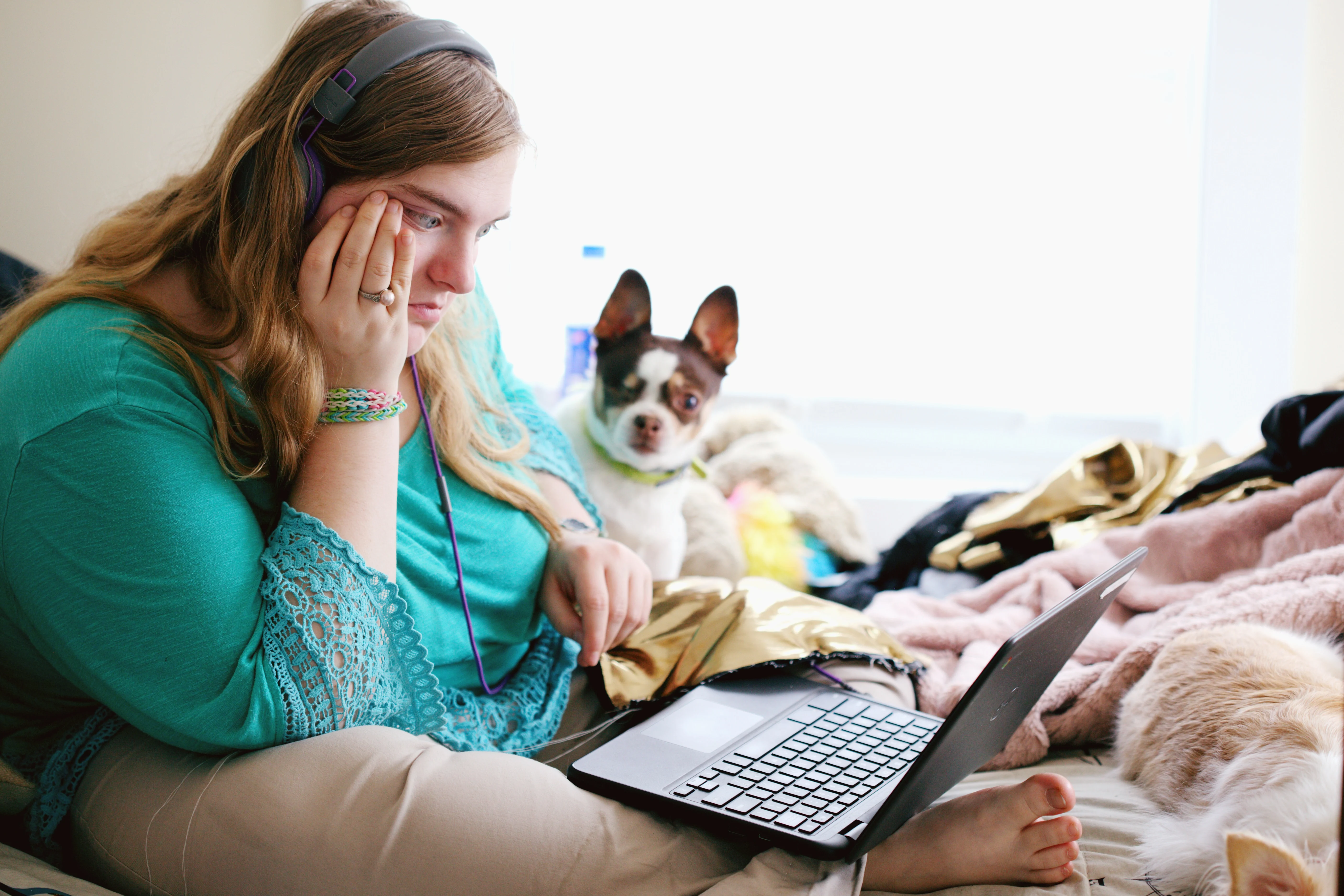 A girl sitting at a laptop