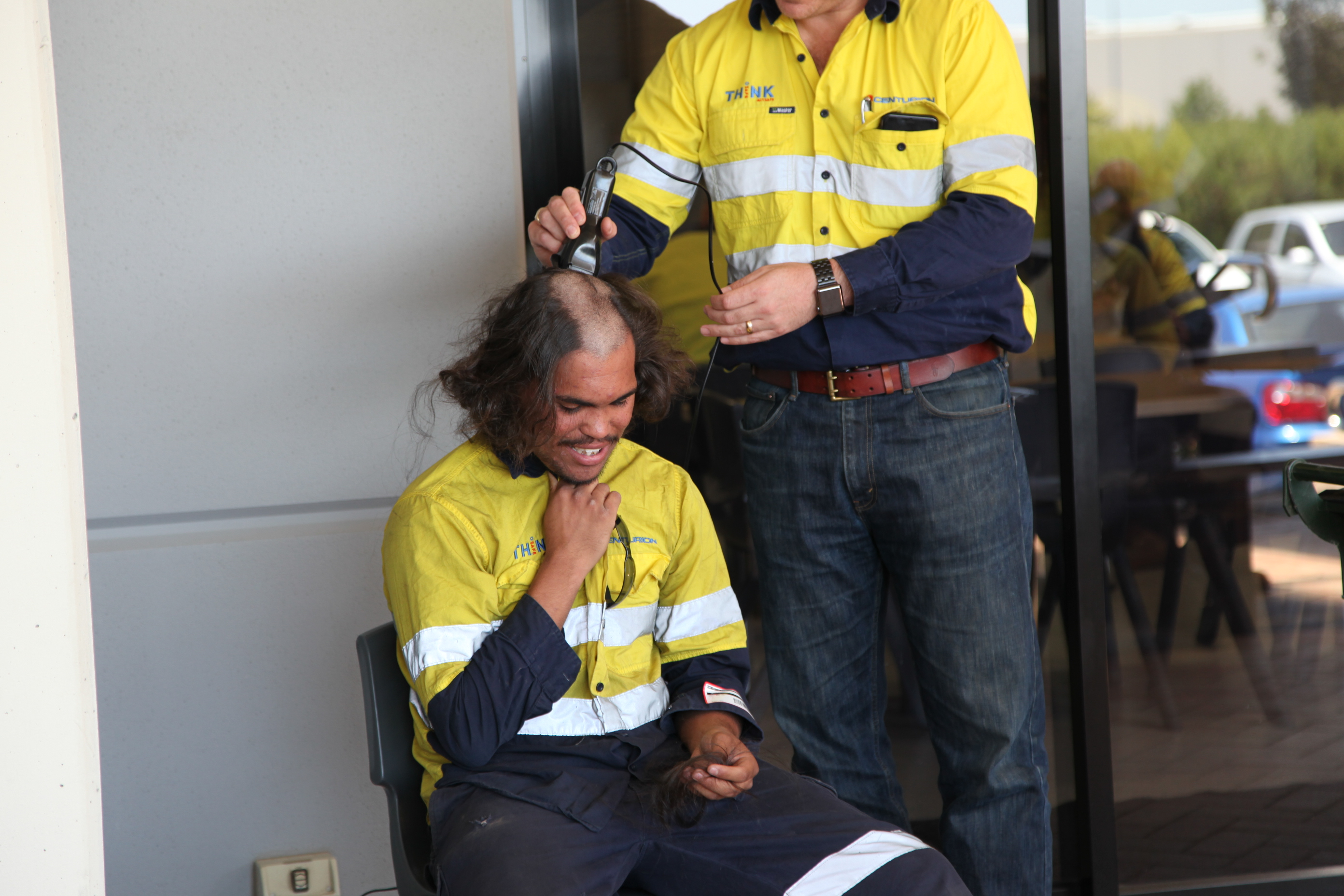 Brandon Rose having his head shaved by Centurion General Manager Gary Nurick