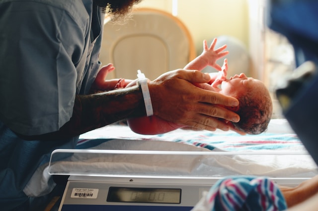 Weighing infant